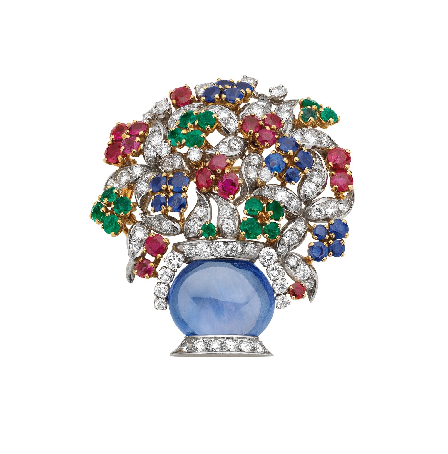 "Giardinetto" brooch in gold and platinum with sapphires, emeralds, rubies and diamonds, 1960. The vase formed of an oval cabochon sapphire on a diamond-set stand, the foliage suggested by leaf-shaped diamond pave set motifs, the flower-heads decorated with circular-cut emeralds, rubies and sapphires. Marks: on the mount, at the base of the vase: "BVLGARI" engraved.